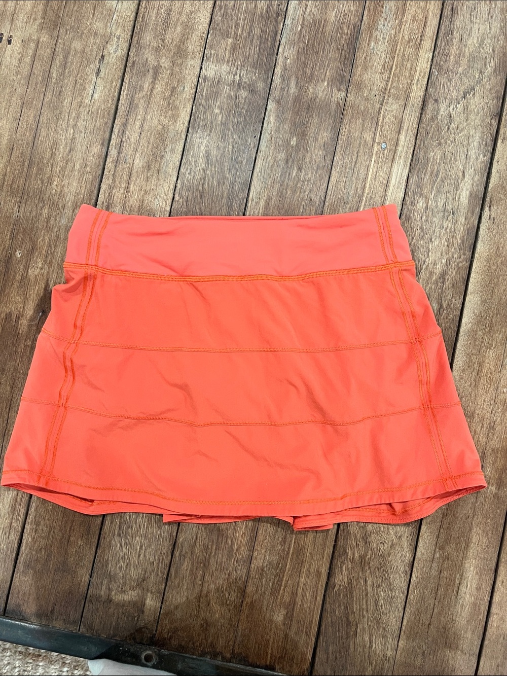 Lululemon pace rival skirt 
Orange size 6
Built in short